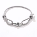 Adjustable gray braided rope bracelet with polished silver interlocking handcuffs charm - Gray