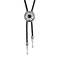 Vintage bolo tie with black gemstone inlay and engraved metallic sunburst motif - Synthetic Black Turquoise
