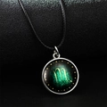 Luminous Scorpio zodiac necklace with green celestial pendant and black cord strap - Scorpio