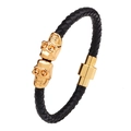Men's black braided leather bracelet with golden skull accents and magnetic clasp - Black Gold Skull