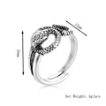 Vintage oxidized silver snake wrap ring featuring detailed scales and adjustable opening - Silver