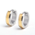 Detailed macro view of silver and gold two-tone stainless steel hoop earrings - Silver & Gold