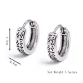 Mens stainless steel hoop earrings with engraved vintage filigree patterns on white background - Silver
