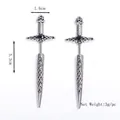 Stainless steel Celtic knot sword earrings featuring a centered black gemstone inlay - Silver
