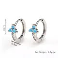 Silver flower huggie hoop earrings with turquoise stones and cubic zirconia accents - Silver