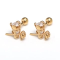 Detail view of golden skull and rose earrings with zircon inlay and screw ball backs - Gold