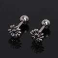 Detailed macro view of daisy stud earrings with blue center diamond and screw-back closure - Dark Blue Rhinestone