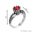 Vintage ghost king ring with silver skeleton design and large red faceted gemstone - Silver