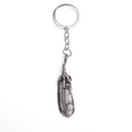 Detailed retro silver feather pendant featuring intricate eagle claw and bird stamp design - Silver