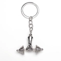 Dettaglio portachiavi fitness argento con pugno che stringe un manubrio in metallo - Argento