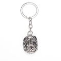 Detailed close-up of a silver-toned metal pitbull head keychain with polished finish - Silver