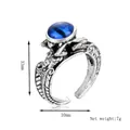 Vintage gothic adjustable alloy ring with blue cat eye stone and wing relief carvings - Silver