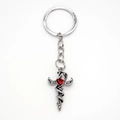 Gothic silver cross sword keychain with a red winged heart gemstone on white background - Silver