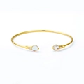 Brazalete abierto de plata S925 dorada con gemas azul claro y detalles de circonita - Plata 925 / Cuarzo Limón Sintético