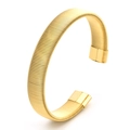 Classic 18K gold-plated C-shaped flexible cuff bracelet with a textured spring design - 12mm Wide / Gold