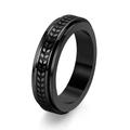 Detailed close-up of a black stainless steel spinner ring with a textured tire tread pattern - US 6 / Black