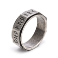 Close-up of vintage Viking spinner ring with engraved Runic symbols on faceted steel - US 6 / Ancient Silver