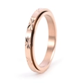 Detailed close-up of 3mm rotating stainless steel ring with 18K gold star pattern - US 5 / Rose Gold