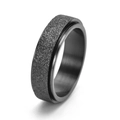 Close-up of black matte spinner ring featuring frosted texture and polished inner band - Black