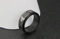 Macro detail of Nordic Viking runes and symbols on black stainless steel spinner ring - US Size 7 / Black