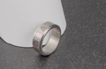 Macro detail of Nordic rune spinning ring with Celtic knot and Vegvisir symbols - US Size 7 / Silver