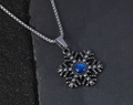 Detailed macro of snowflake pendant with blue stone on dark stone background - Ink Blue Pendant Only (Without Chain)