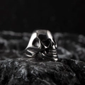 Polished stainless steel skull ring with vintage silver finish on dark rock - US Size 7 / Silver F (High Polished Skull Style)