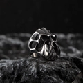 Polished vintage stainless steel skull ring with gothic punk design on dark rock base - Silver Z (Hollow Skull Style)