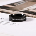 Detail view of a black stainless steel ring with a central row of sparkling cubic zirconia - US 8# / White Rhinestone
