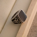 Macro shot of vintage titanium steel ring with black resin inlay and Celtic knot details - US Size 9 / Celtic Knot Style (SA904)