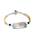 Driekleurige roestvrijstalen armband met opengewerkte staaf en roségouden strik-accent - Driekleurig Splicing (Roségoud/Goud/Zilver)