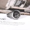 Vintage stainless steel signet ring for men featuring an engraved star and leaf pattern - US Size 7