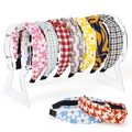 9-piece set of knotted fabric headbands with floral and plaid patterns on acrylic display - Transparent Headband Display Rack