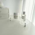 Close-up of frosted acrylic wave display tray with cylindrical silver metal legs - Transparent Matte Moon