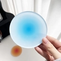 Modern circular acrylic coaster with blue sunset gradient and frosted translucent finish - Blue