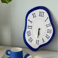 Creative blue melting wall clock with Roman numerals in surrealist art style for home decor - Blue White