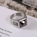 Vintage stainless steel ring featuring a square red gemstone with ornate engravings - US 7 / Red