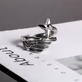 Vintage silver angel wing ring with star motif and oxidized finish in 45-degree angle - US Size 7