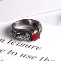 Vintage wing relief ring in antique silver with a faceted red round gemstone - US Size 7