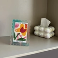 Detail of 7-inch iridescent acrylic photo frame with a wavy scalloped edge design - Iridescent