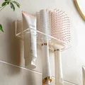 Wall-mounted clear acrylic bathroom organizer for toothpaste and combs, no-drill installation - Clear 3-Slot Wall Mounted Rack