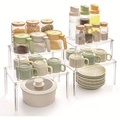 Clear acrylic tiered organizer shelves for kitchen cabinet and pantry countertop storage - Set of 4