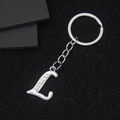 Silver metal letter L keychain with sparkling rhinestones and a polished finish - L