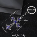 Silver vintage cross keychain with blue rhinestones and intricate scrollwork detail - Vintage Silver Blue Rhinestone