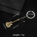 Portachiavi retrò a forma di chitarra in bronzo con incisione musica e ciondolo in lega - Stile Chitarra 79 (B1650)