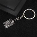 Porte-clés Tarot en argent avec le design The Star en émail noir sur pendentif métal - L'Étoile Tarot Porte-clés