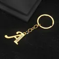 Golden alloy letter A keychain featuring inlaid sparkling white crystals on black background - Letter A Style / Gold