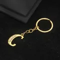 Golden keychain with letter C pendant featuring sparkling rhinestones on black background - Letter C Style / Gold