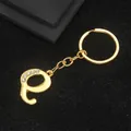 Gold-plated letter P keychain featuring clear rhinestones and a polished alloy finish - Letter Q Style / Gold