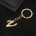 Polished gold letter Z keychain with sparkling rhinestone accents for bags - Letter V Style / Gold